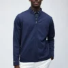 Die mit Fleece gefütterte Golfjacke Die mit Fleece gefütterte Golfjacke