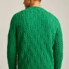 Wollpullover mit Rundhalsausschnitt und Zopfmuster Wollpullover mit Rundhalsausschnitt und Zopfmuster